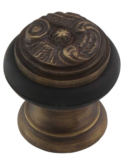 Rococo Floor-Mount Doorstop in Antique Brass.